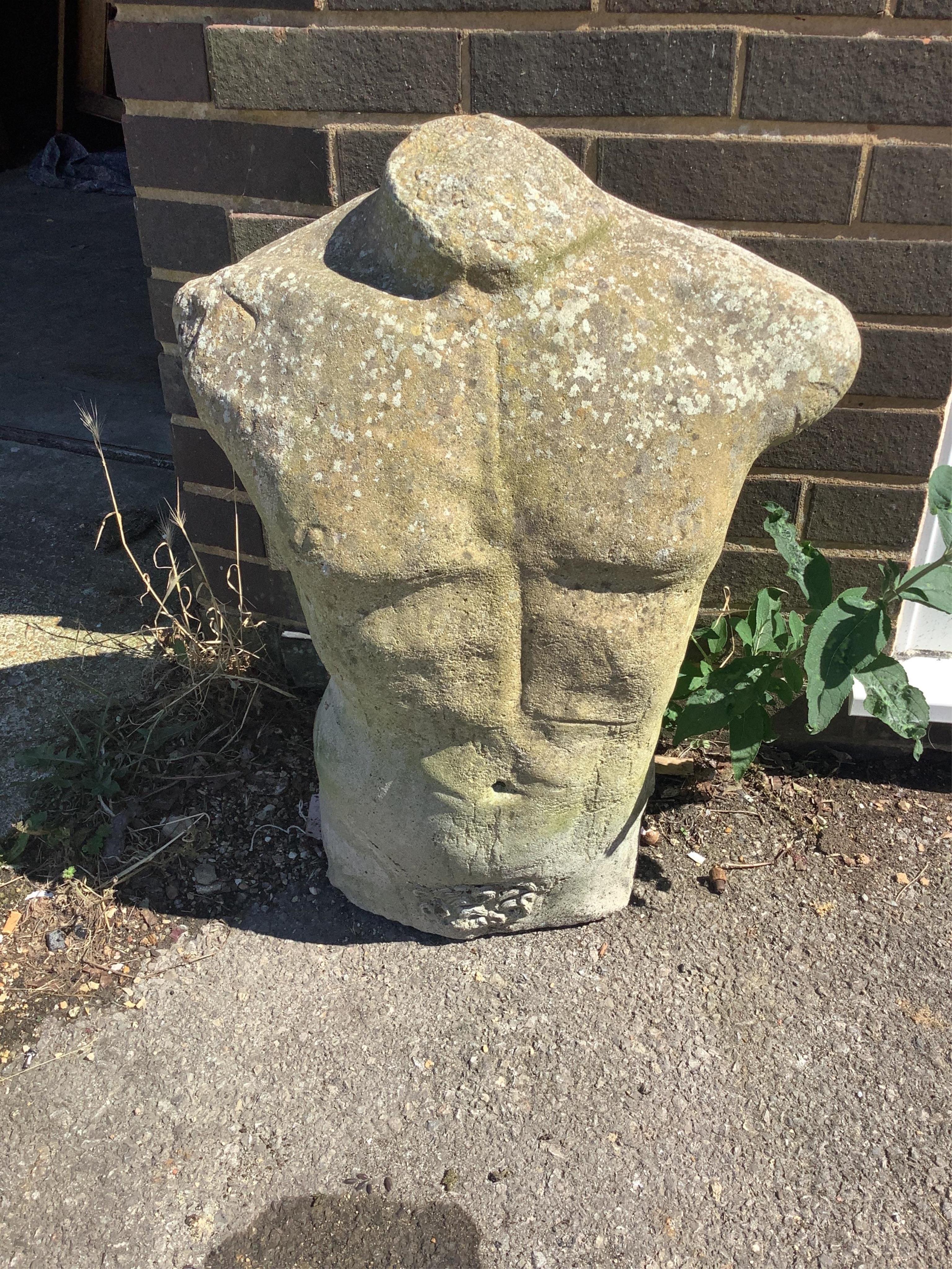 A reconstituted stone male torso garden ornament, height 68cm. Condition - fair